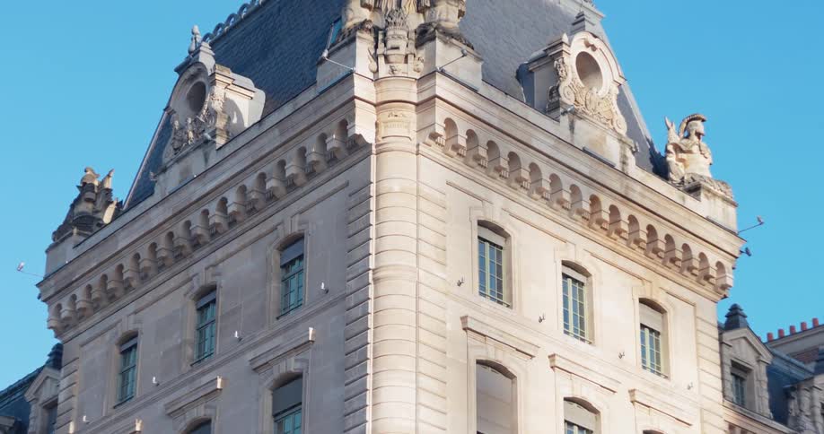 The caserne de la cit in paris features an artistic rooftop statue illuminated at midday