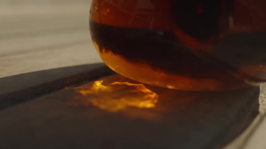 Amber reflection of a glass container illuminated by sunlight