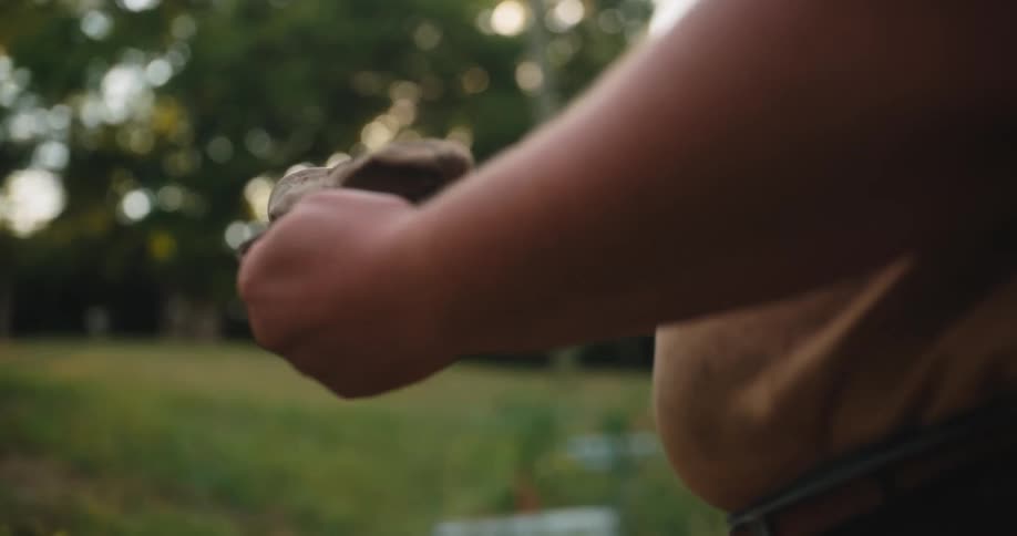 Man puts on work gloves before starting the task