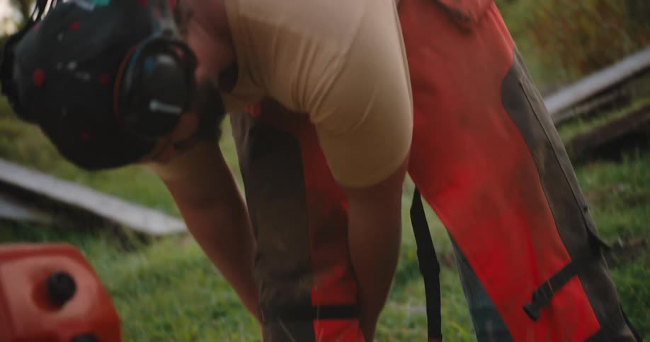 Man wearing ear protection gets ready to operate equipment
