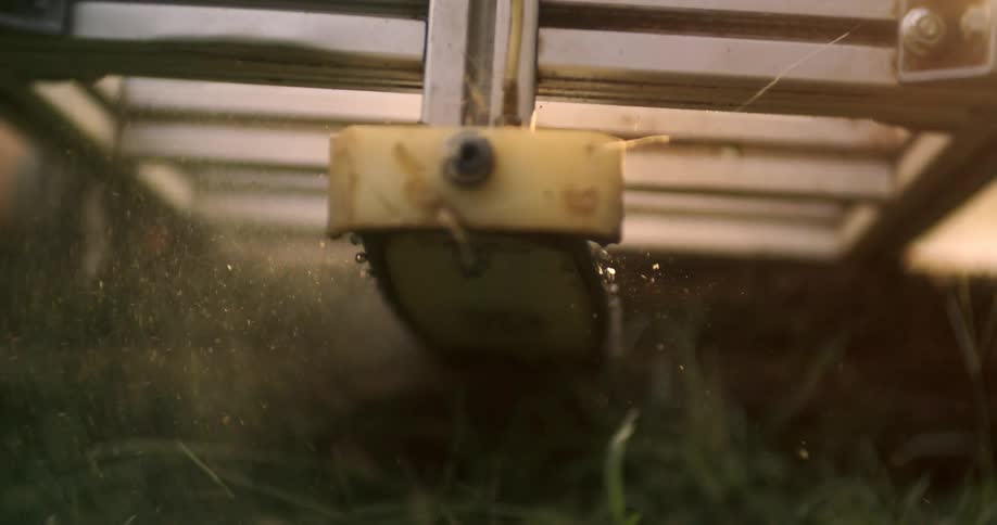 Close up of a farm machinery in use outdoors on a field during daytime