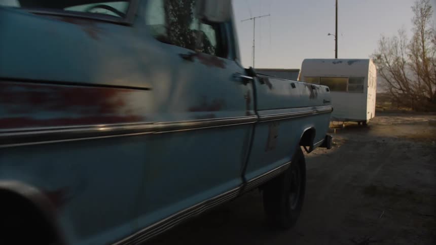 A truck leaves the front of a home