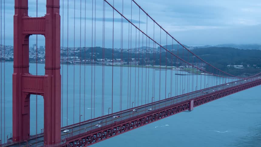 Vehicle traffic moves across the golden gate bridge on a cloudy day
