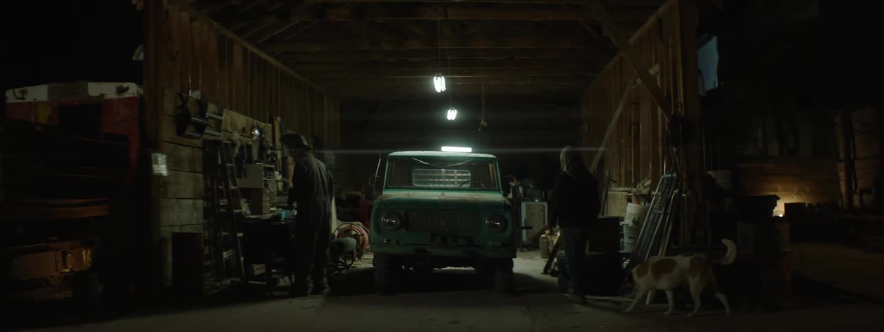 A man walks around a garage
