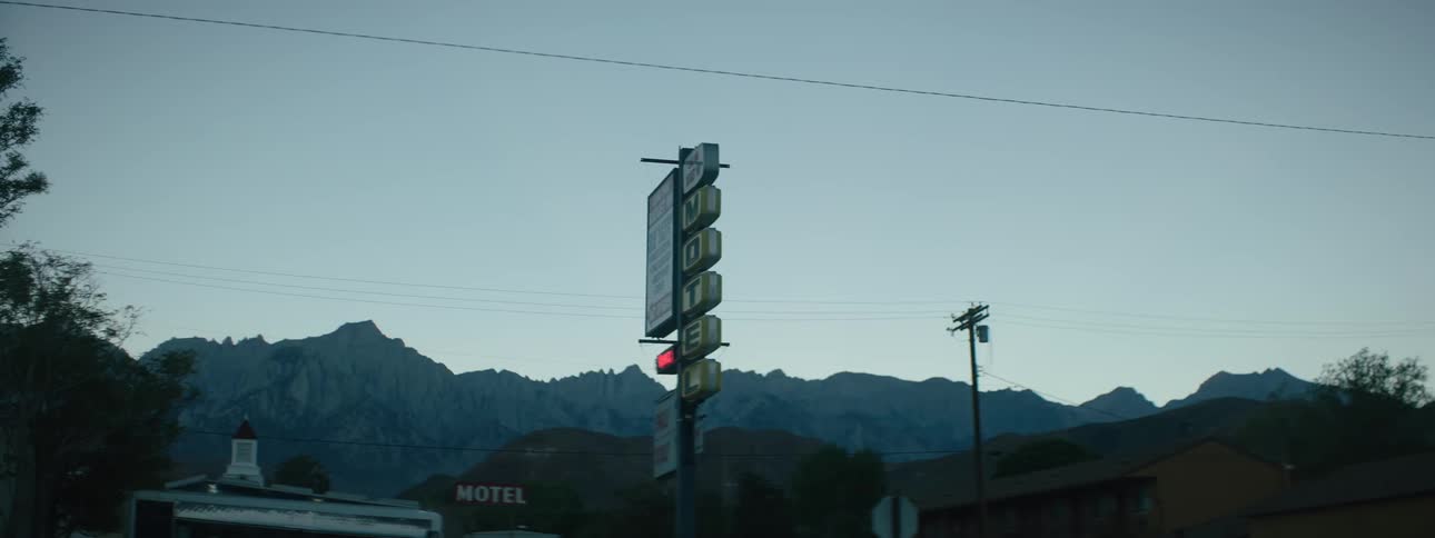 Motel sign in a town after sunset
