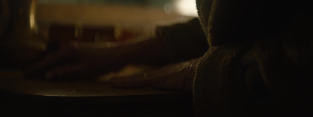 A person is tracing their hands on a table
