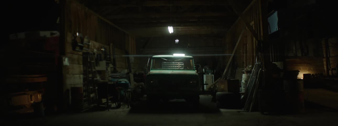 Lights are flickering in a garage at night