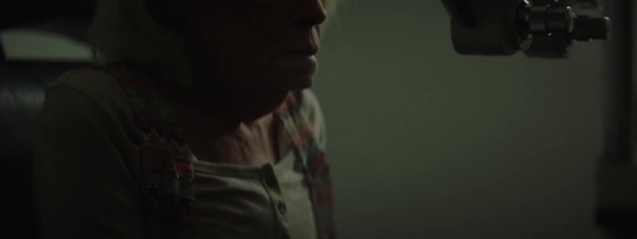 A person is crying in a dark room