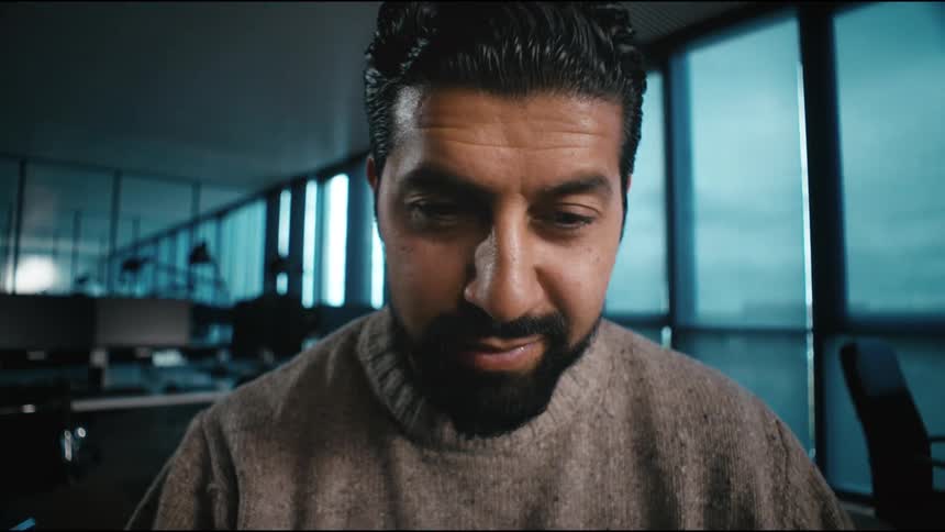 a man sends away an email happily