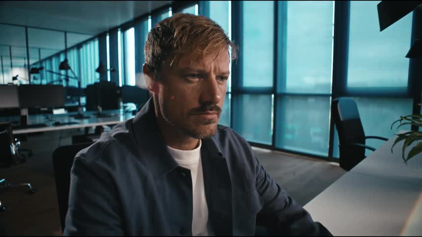 Man works serious and focussed at desktop computer
