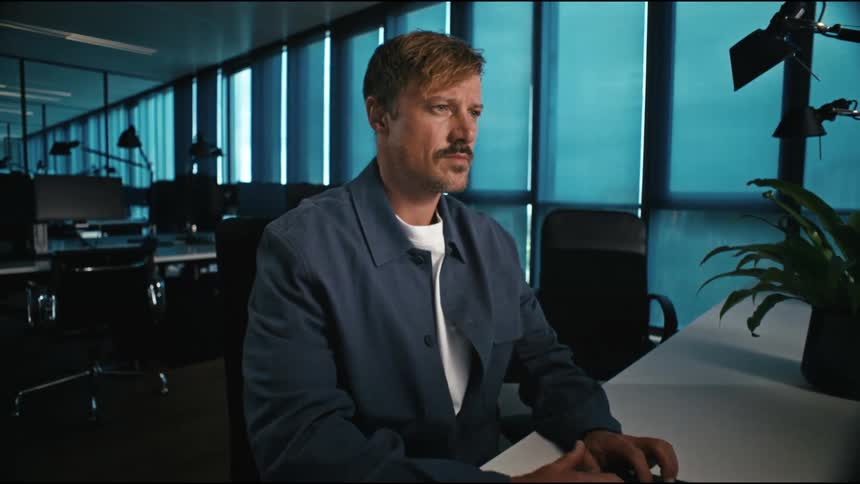 Man is focussed on his work in the office