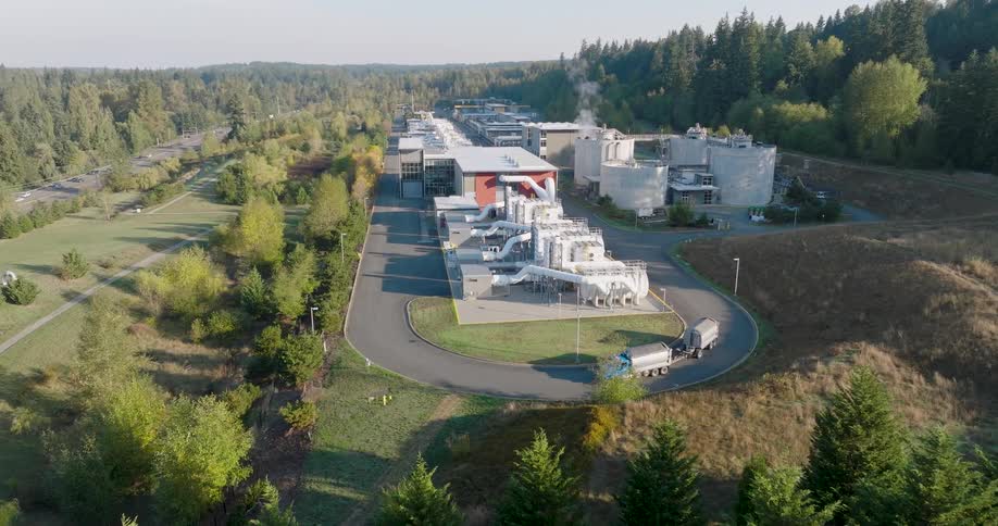 A truck enters a wastewater treatment plant to be loaded with biosolids after processing