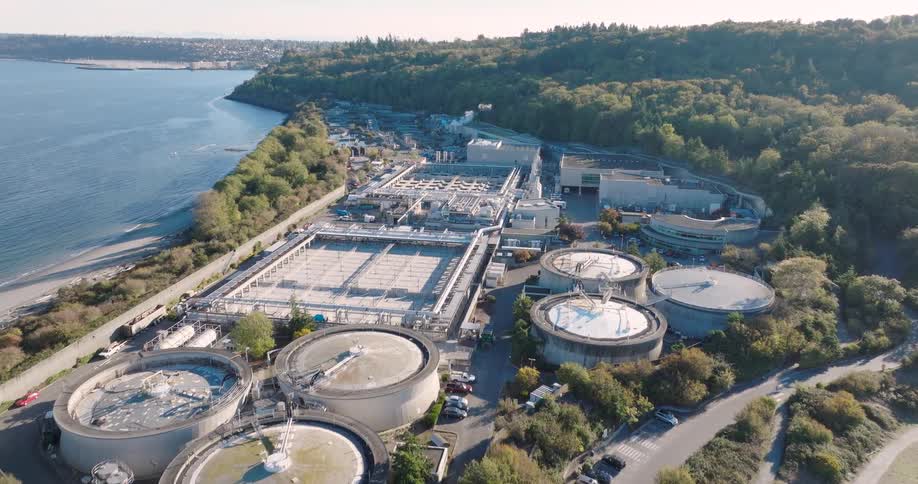 A large water treatment plant is situated near coastal shoreline