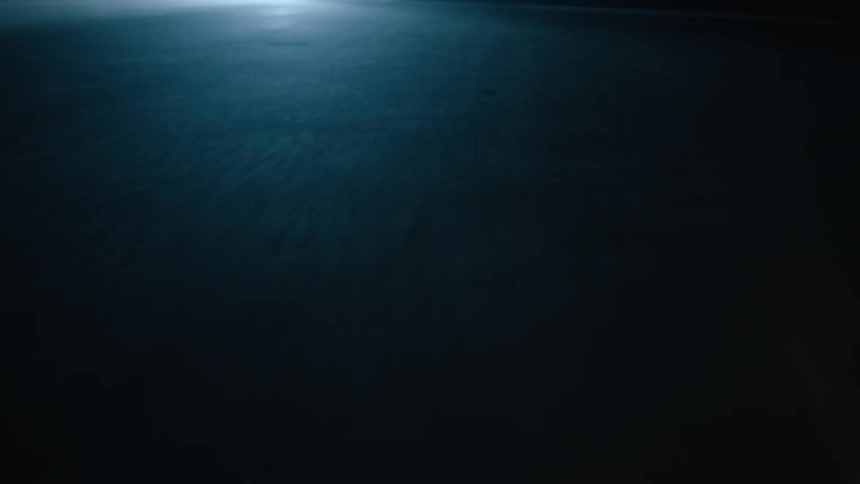 Car driving on pavement at night