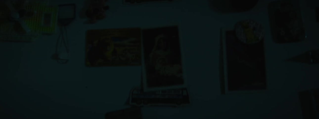 Pictures hang from a refrigerator