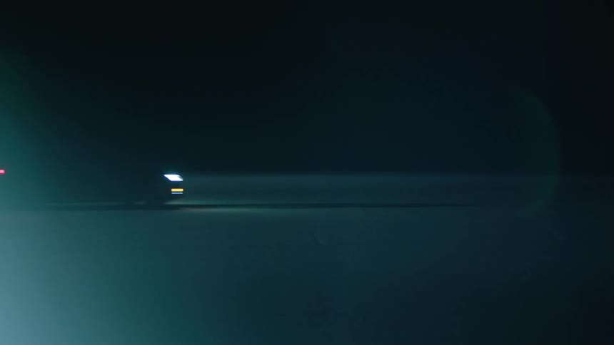 A car drives by at night