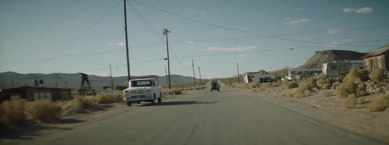 Two vehicles race down the road together