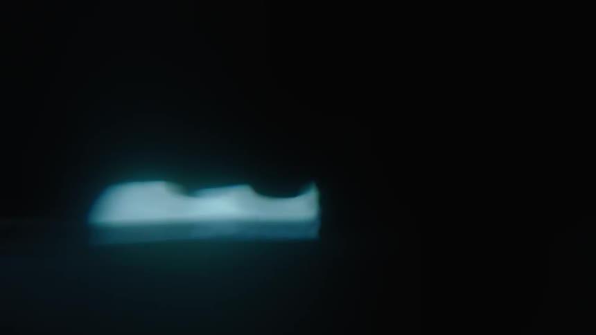 Lights from a car are in the dark