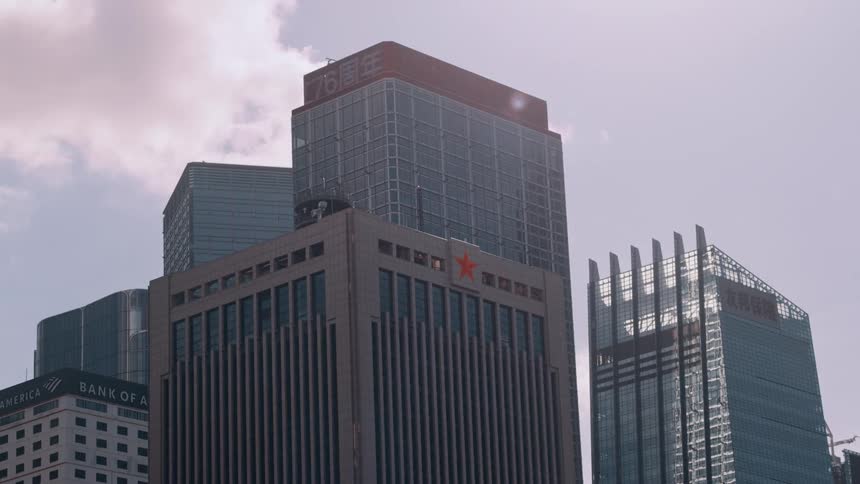 Corporate skyscrapers under bright sunlight in hong kongs financial district