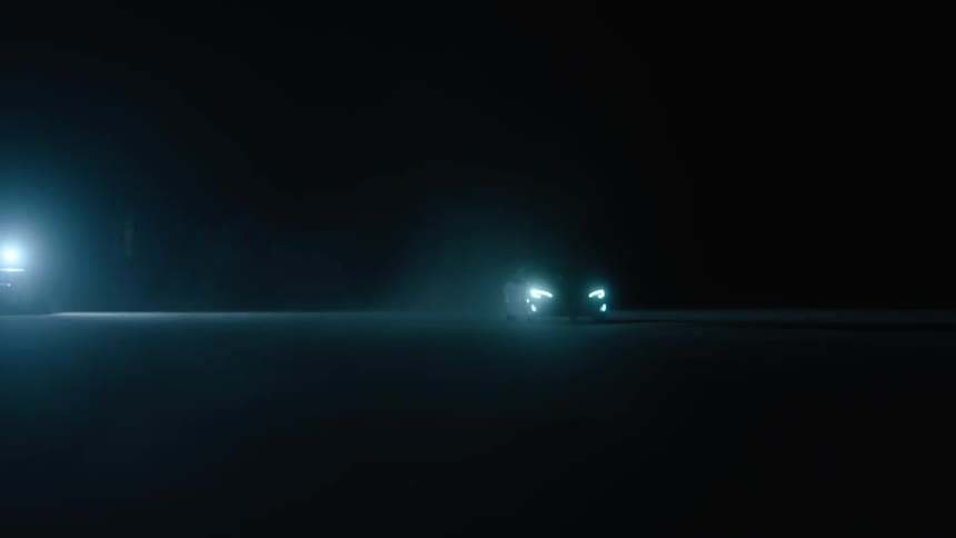 A car travels in the dark ahead