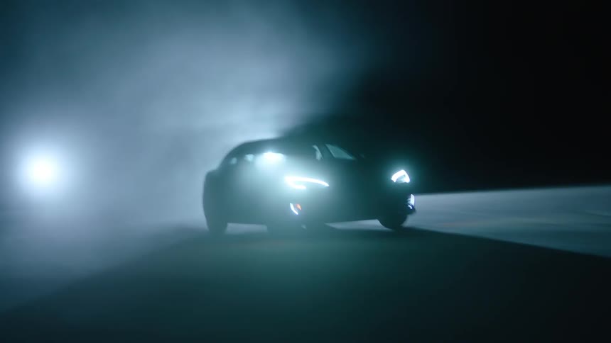Car speeding at night being followed by two others