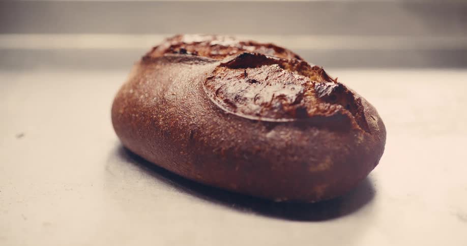 Close up of a baked bread placed on a surface