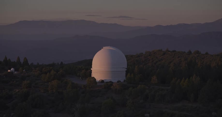 A large telescope is in the woods