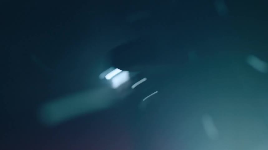 A car is racing through the snow at night