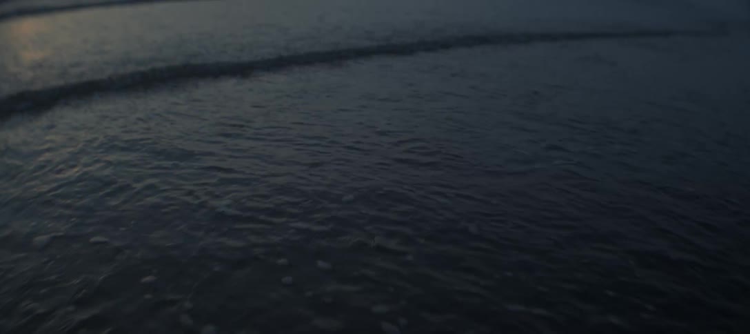The sun is rising on the beach