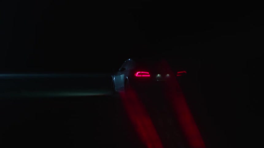 A car drives at night