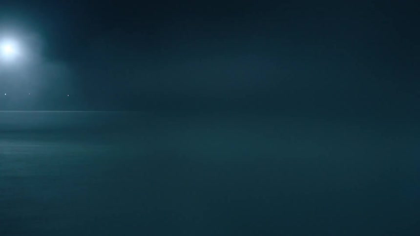 A car driving around at night in a lot