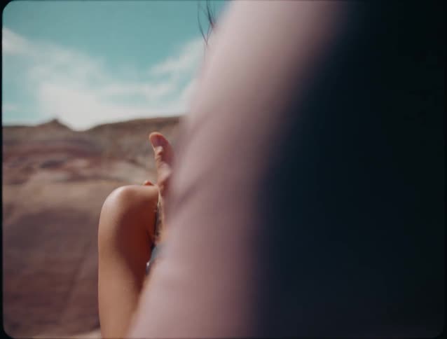 A man and woman hug in the canyon