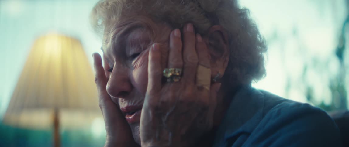 A woman speaks and moves her hands