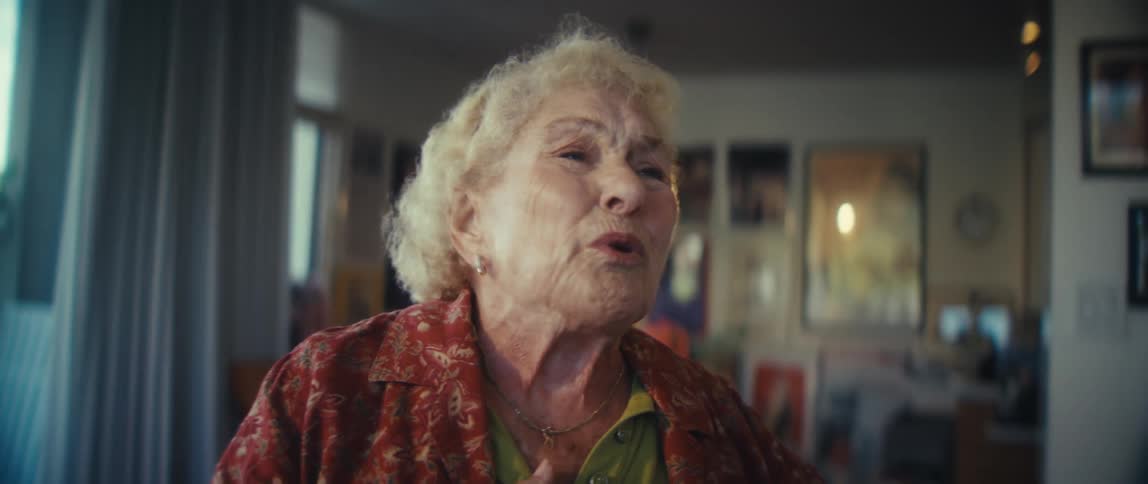 The woman is singing and dancing