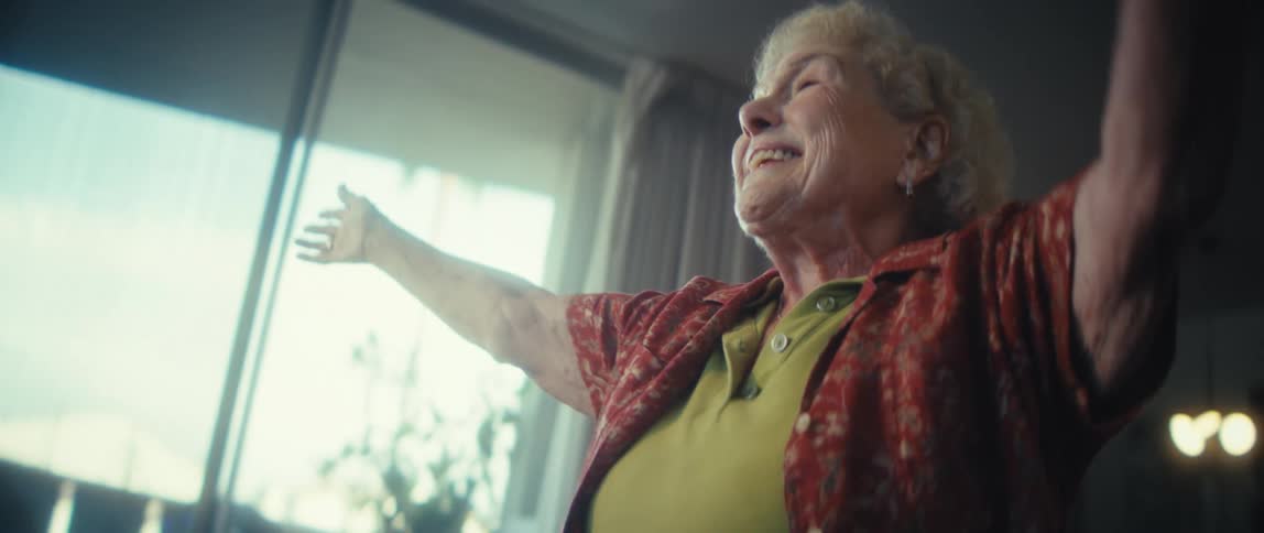 The woman spins as she dances and sings