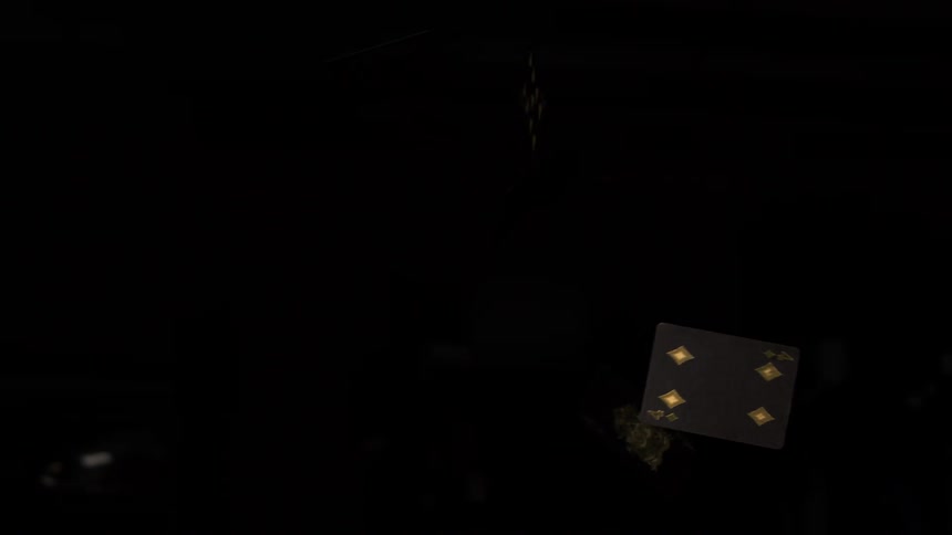 Playing card with golden diamonds floating against a dark background