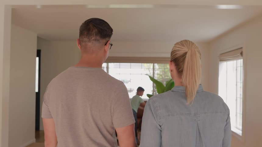 Parents watch their children play in the living room