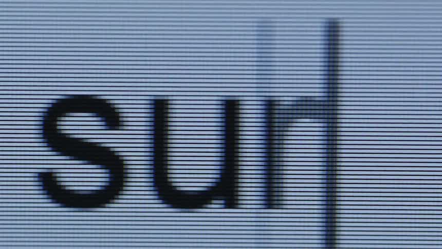 Word being typed on a magnified screen with visible pixel lines