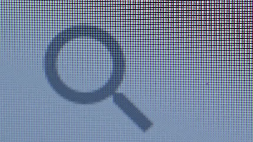 Magnifying glass icon zoomed in on a screen with visible pixels