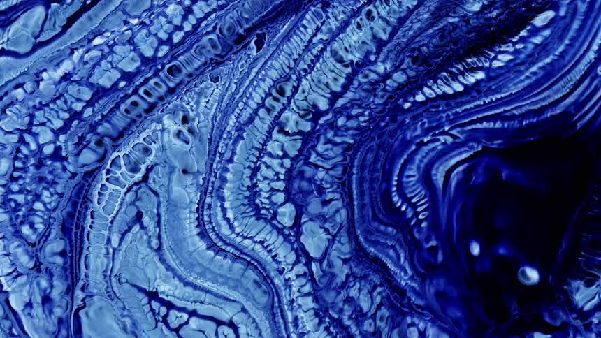 A marbled pattern of swirling blue and white ridges that resembles agate stone or microscopic cellular layers