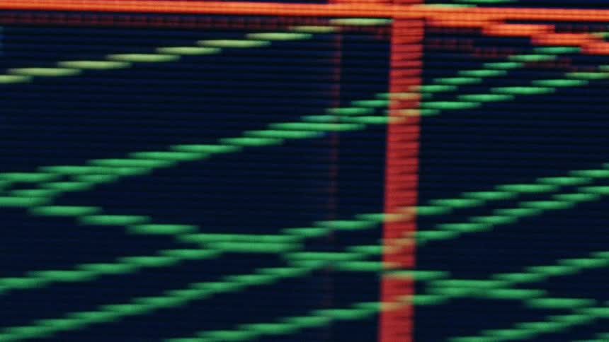 A macro close up of a digital display shows the rgb subpixel grid forming white numerals and slanted green lines with a single bright red vertical stripe on a dark background