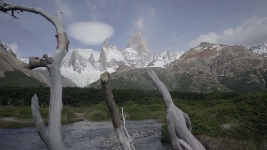A river flows around a bend in the mountains