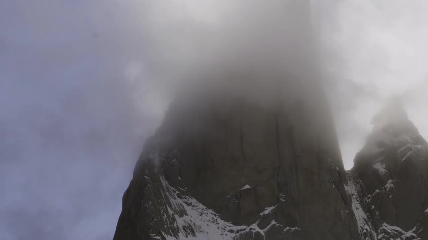 Mist surrounds mountain peaks