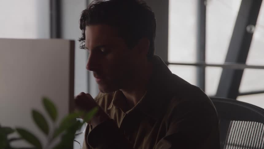 A man sits in a chair