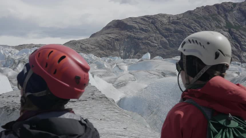 People are walking on ice on a mountain