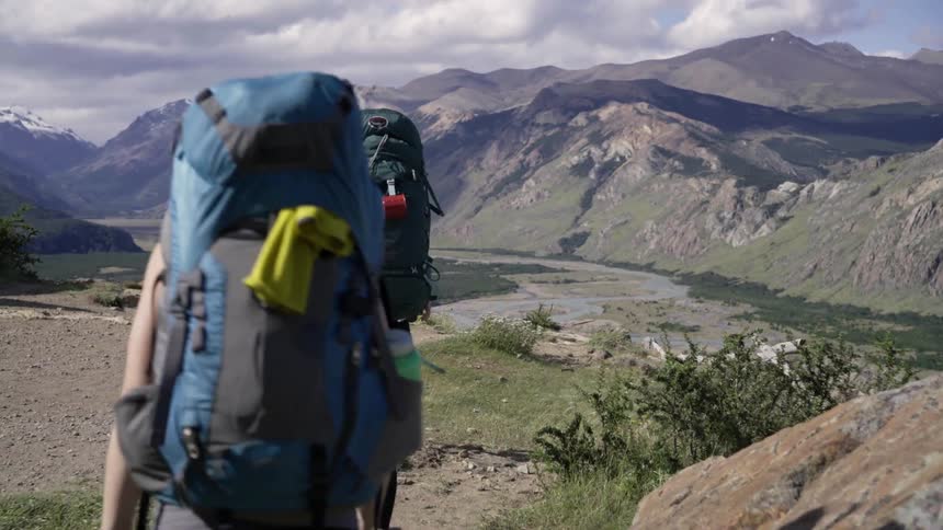 People are hiking with backpacks