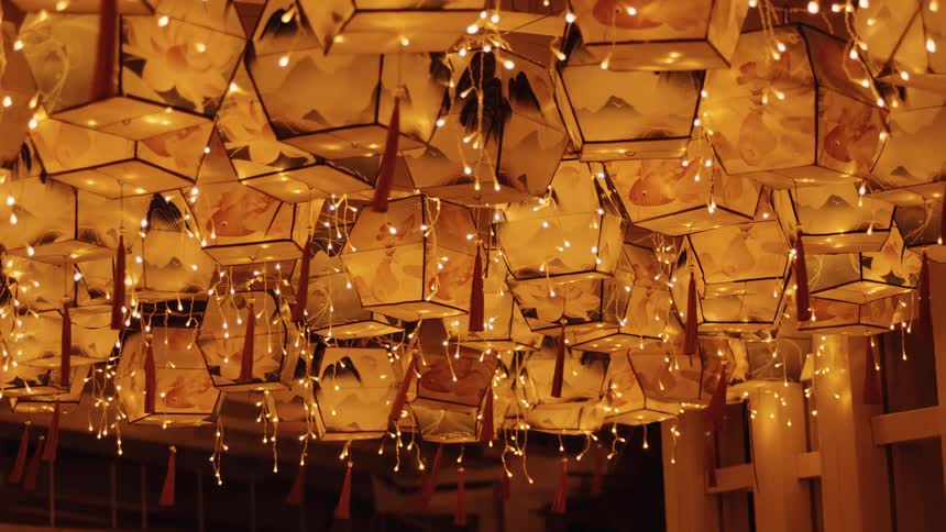 Paper lanterns sway in the breeze