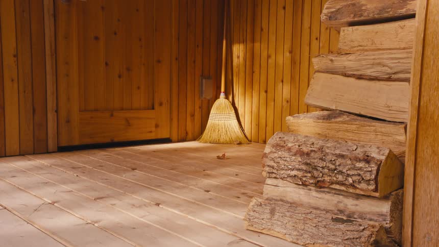A broom in the corner of a room
