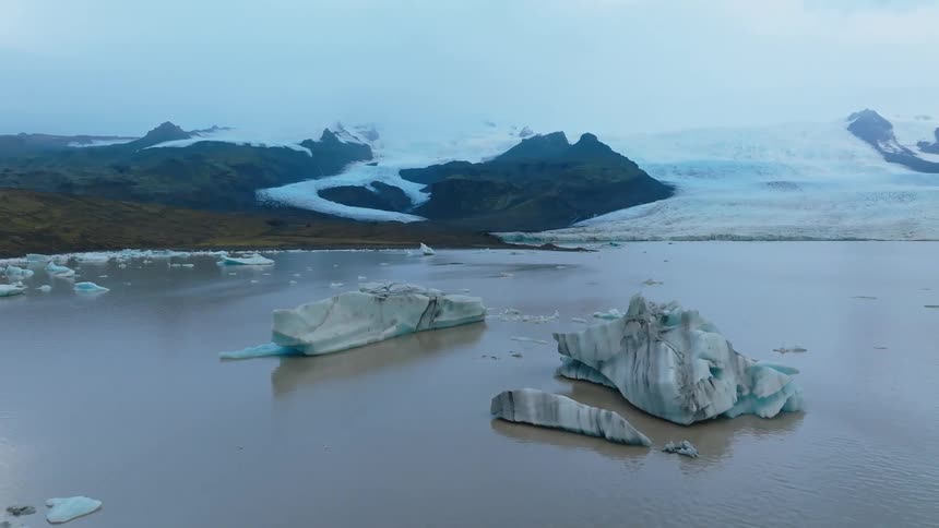 Icey water by snowy land