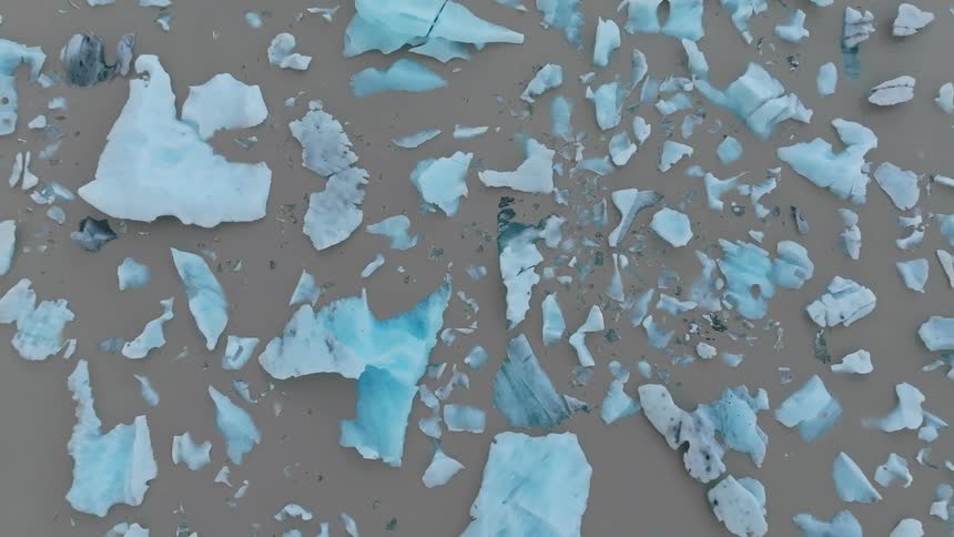 The sand is littered with ice